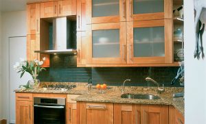 Remodeled kitchen with wood-tone cabinets.